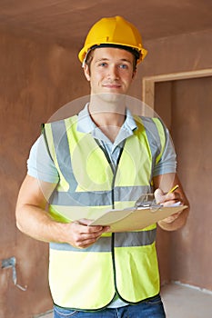 Building Inspector Looking At New Property