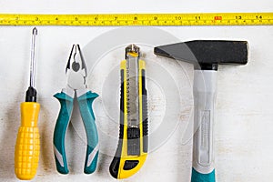 Building instrument set, tape measure, pliers, screwdriver, ruler, hammer and utility knife