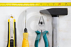 Building instrument set, tape measure, pliers, screwdriver, ruler, hammer and utility knife