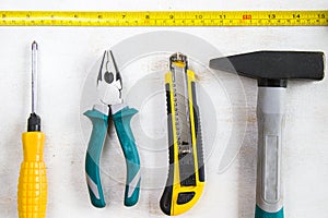 Building instrument set, tape measure, pliers, screwdriver, ruler, hammer and utility knife