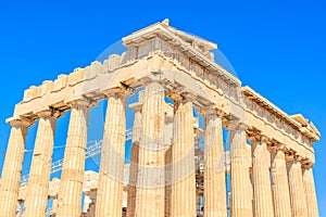 The building is a large, ancient structure with many columns
