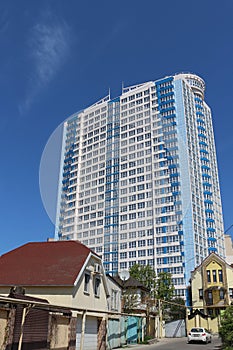 Building. Large building. new building. old building. blue sky. multi-storey building. two storey private houses.