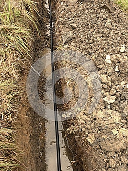 Building of lines of metallic and fiber optic cables. Laying underground tow network connection cable.