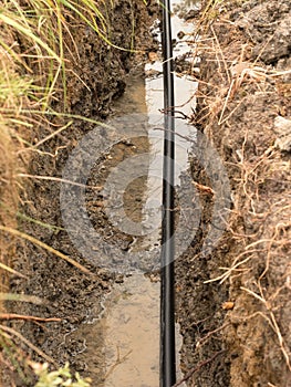 Building of lines of metallic and fiber optic cables. Laying underground tow network connection cable.