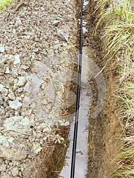 Building of lines of metallic and fiber optic cables. Laying underground tow network connection cable.