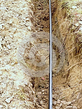 Building of lines of metallic and fiber optic cables. Laying underground tow network connection cable.