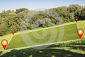 Building lot on hilly land - Land plot management - Real estate concept with a vacant land on a green field with trees on