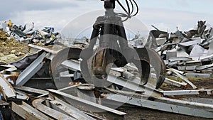 Building machine dismantles debris rubble on old sport arena