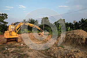 Building Machines: Digger loading trucks with soil. Excavator loading sand into a dump truck. Work in the quarry.