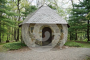 Building made of rocks in a wooded area