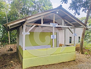 A building made of wood in the middle of the forest