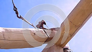Building master with electric screwdriver at work. Clip. Professional carpenter working with wooden material at the new