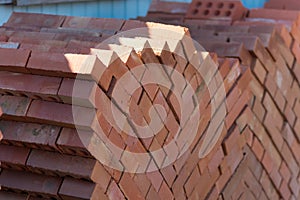 Building material - red brick folded on a pallet