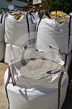Large sacks of aggregates for making concrete mixes. photo
