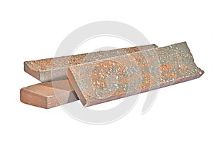 Building Materials Ideas. Red Elongated Pavement Road Stone Sample Tiles Isolated Over White