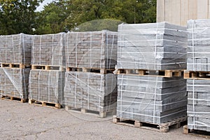 Building materials outdoors. Packed new building materials. photo