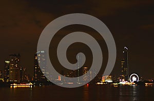 Building near river in night of Bangkok Thailand