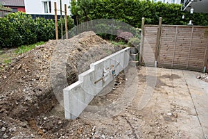 Building a new garden with stones, fences and trees