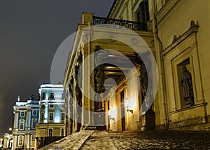 Building of New Hermitage with statues of Atlanteans in center of St.Petersburg at night, Russia