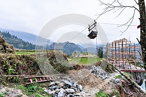 Building a new house on hill of Dazhai village