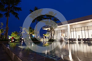 Building at night time reflection on water