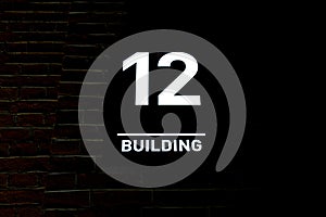 Building number 12. Numberplate
