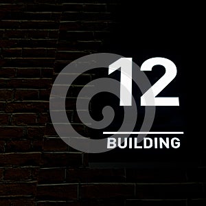 Building number 12. Numberplate