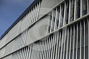 Building is outside. Windows in building. Vertical lines in architecture