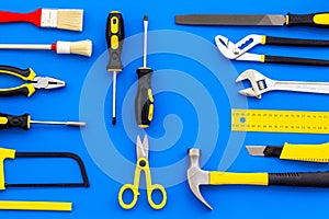 Building, painting and repair tools for house constructor work place set blue background top view pattern