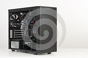 Building of PC, ATX motherboard inserted to black computer midi