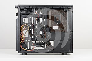 Building of PC, ATX motherboard and power supply unit inserted t