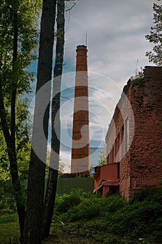 Building and pipe made of red brick, boiler room for heating enterprises or apartment buildings