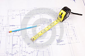 Building plans and tape measure photo