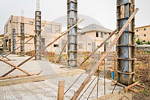 Building process of a house column in construction site on housing project