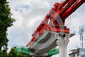 Building railway concrete structure using truss launcher, Skytrain construction in progress