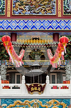 A building with red lanterns hanging from the roof photo