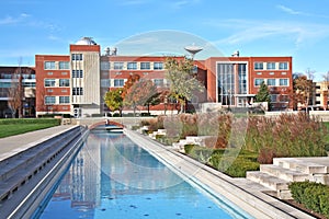 Building and reflecting pool on a university campu