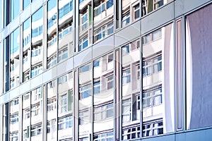 Building reflection on glass facade, modern office facade