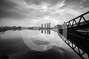 Building reflection on the lake surface, soft and dramatic cloud with colorful on the sky