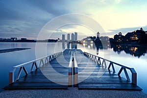 Building reflection on the lake surface, soft and dramatic cloud with colorful on the sky