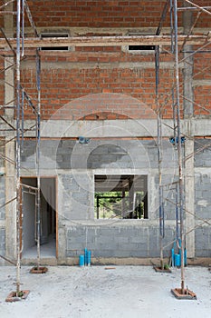 Building residential construction house with scaffold steel