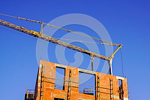 Building residential Construction Site house with crane in blue sky