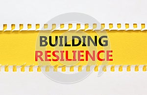 Building resilience symbol. Concept word Building resilience typed on yellow and white paper. Beautiful yellow and white