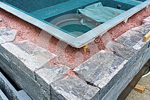 Building a rock encased spa and hot tub