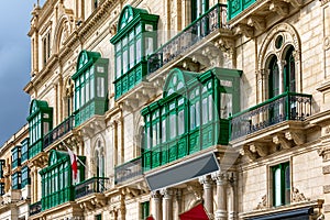 Building`s facade with traditional balconies in Valletta, Malta