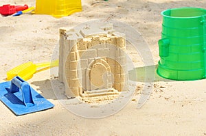 Building Sandcastle By The Beach