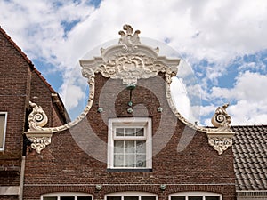 Building with sculpted bell gable in Lemmer, Friesland, Netherlands