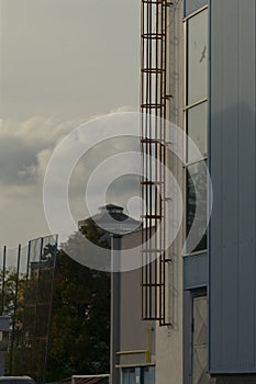 building side with lamp and ladder security guard perspective