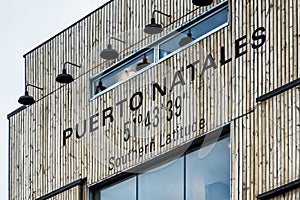 Building with a sign saying Puerto Natales