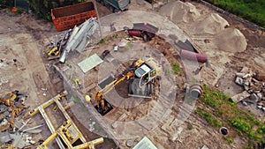 Building site. Construction workers working on a new expressway construction using professional machines. Safety concept